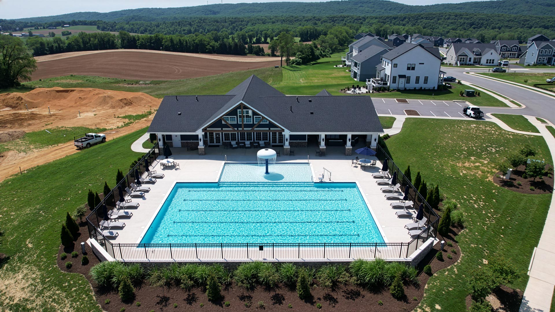 Exterior aerial photograph of the Westhill Clubhouse and outdoor pool in the Kipps Farms neighborhood of Blacksburg, VA.