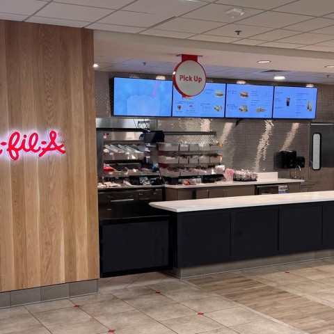 Photo of the counter and register area of a Chick-fil-A restaurant. thumb