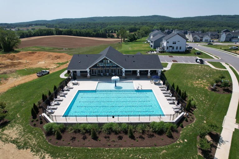 Exterior aerial photograph of the Westhill Clubhouse and outdoor pool in the Kipps Farms neighborhood of Blacksburg, VA.