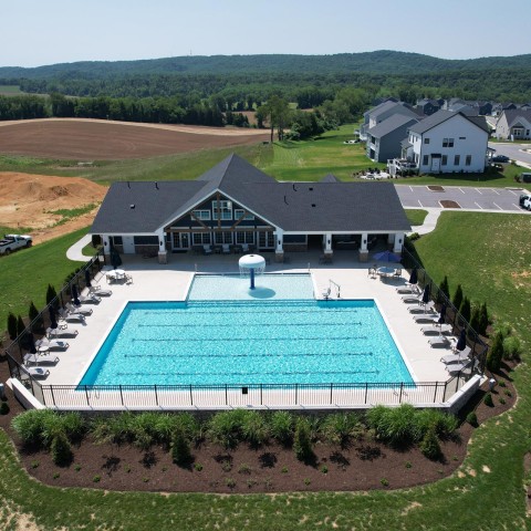 Exterior aerial photograph of the Westhill Clubhouse and outdoor pool in the Kipps Farms neighborhood of Blacksburg, VA. thumb